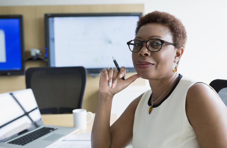 Confident woman at her desk