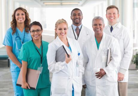 Large diverse group of hospital doctors, surgeons, and nurses