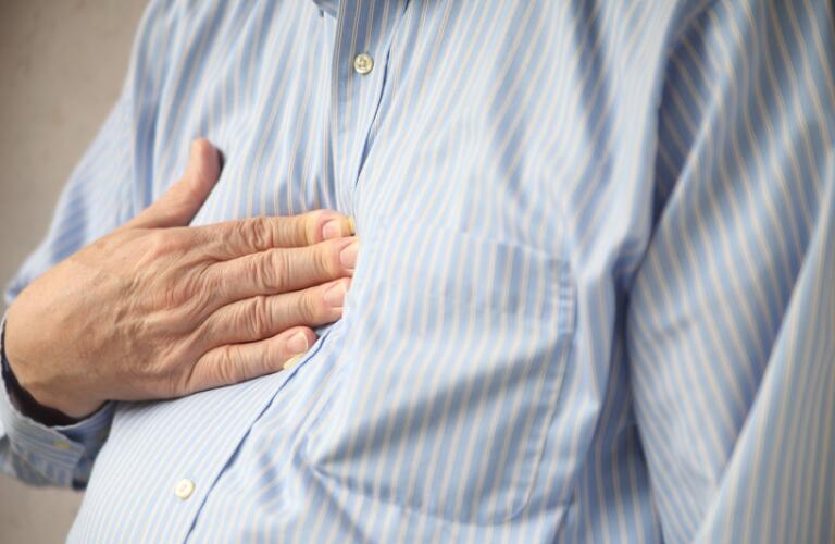 man-with-heartburn-pressing-chest