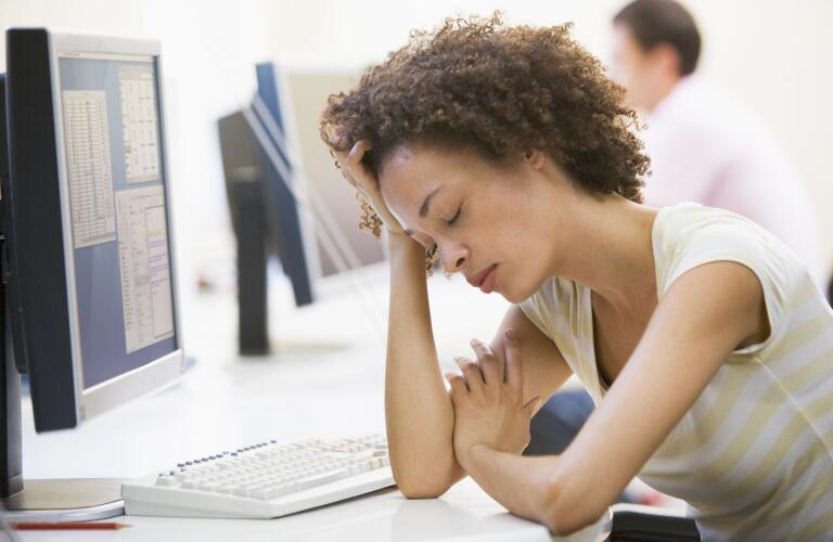 Woman in computer room sleeping