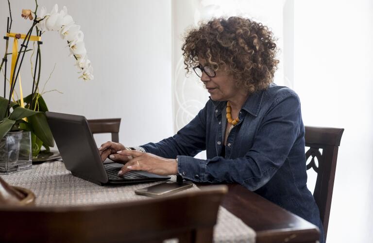 Middle-aged woman on laptop