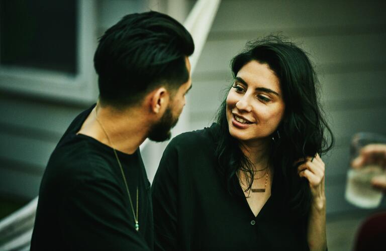 couple looking at each other and talking outside