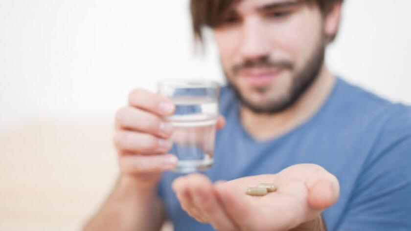 Man taking pill