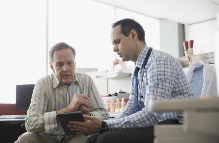 senior-man-talking-with-doctor