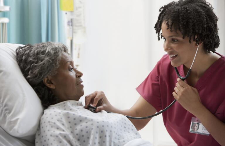 nurse-using-stethoscope-on-patient