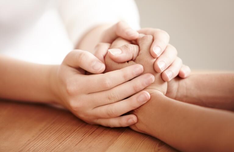 holding-hands-on-table
