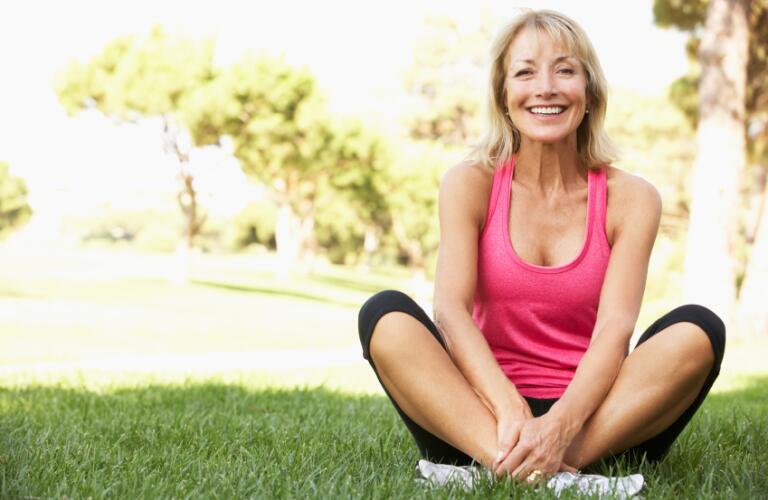 happy senior woman exercising outdoors