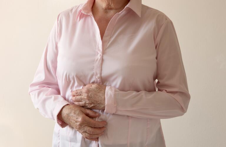 Older woman with stomach pain