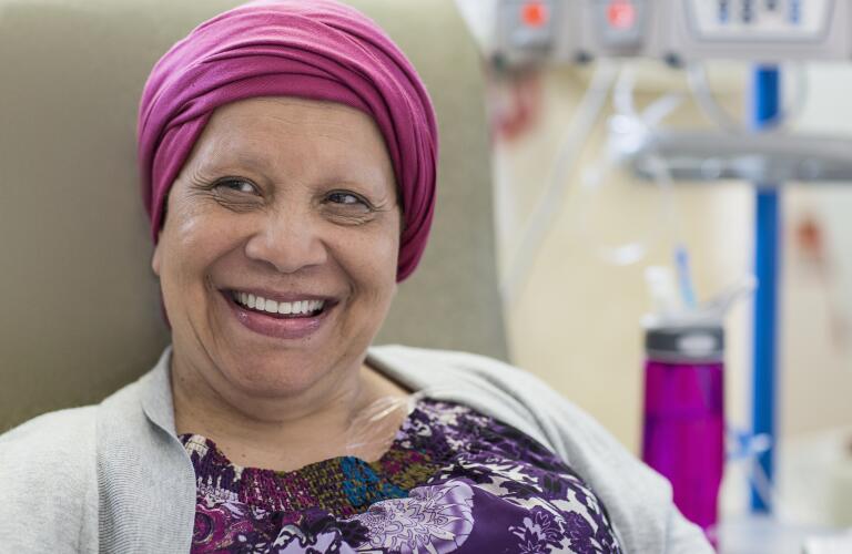 Patient in infusion room smiling