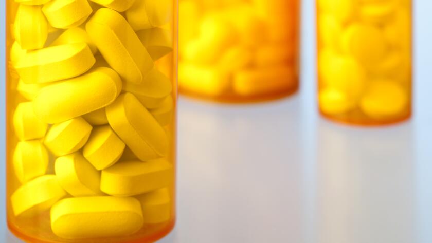 Close-Up of Prescription Medicine Bottles Containing Pills and Tablets
