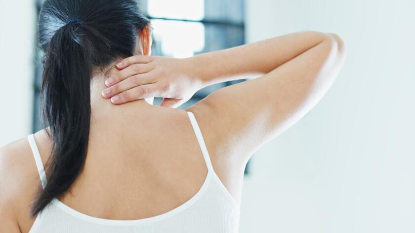 Woman Touching Neck