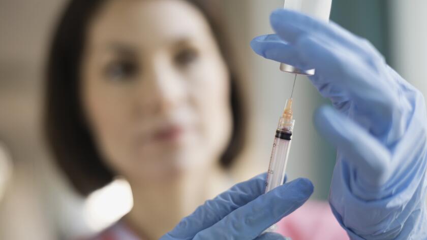 female-nurse-holding-syringe