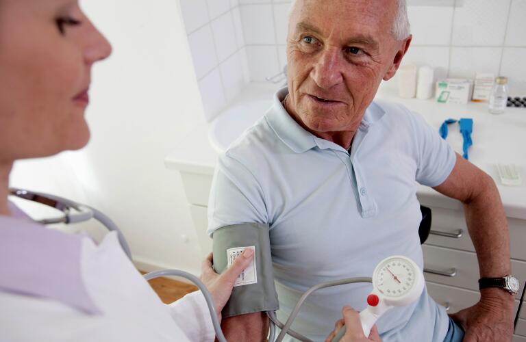 Doctor patient's taking blood pressure