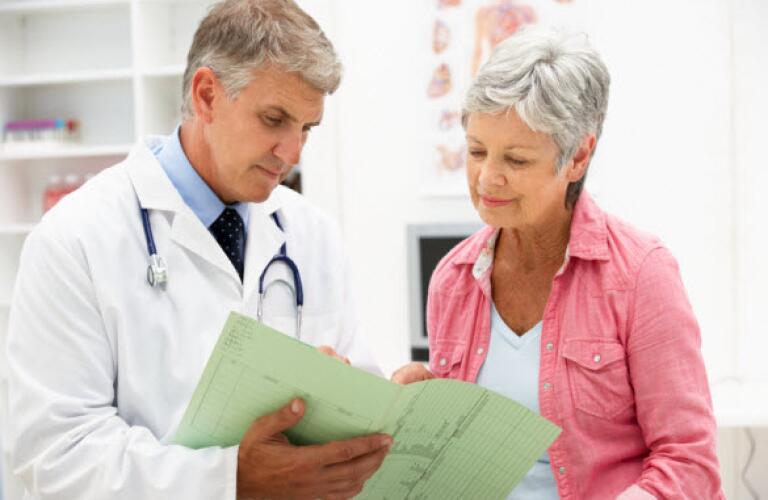 Woman talking to doctor