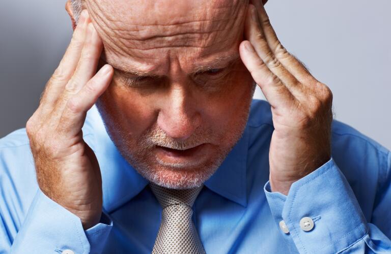 stressed-man-with-hands-on-head