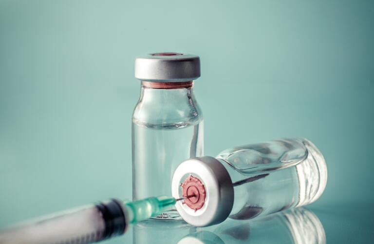 medication bottles with syringe