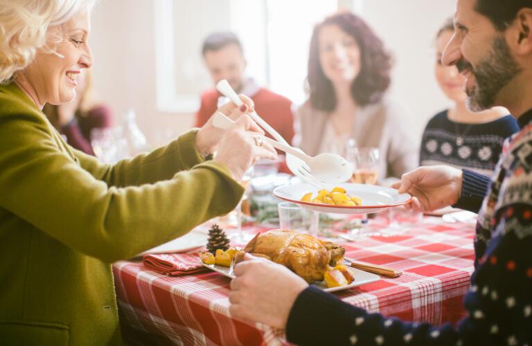 people-passing-food-at-holiday-party