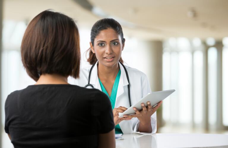 Female doctor talking with patient