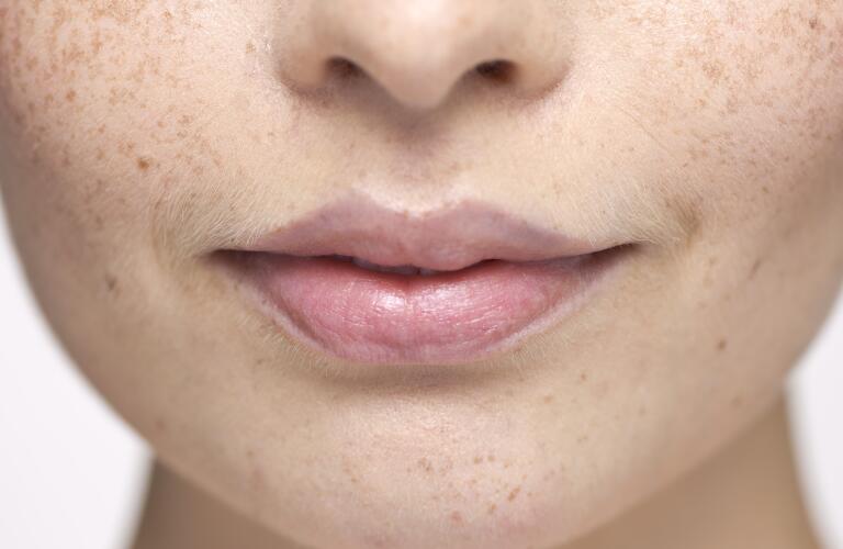 Close-up of young woman's face and lips