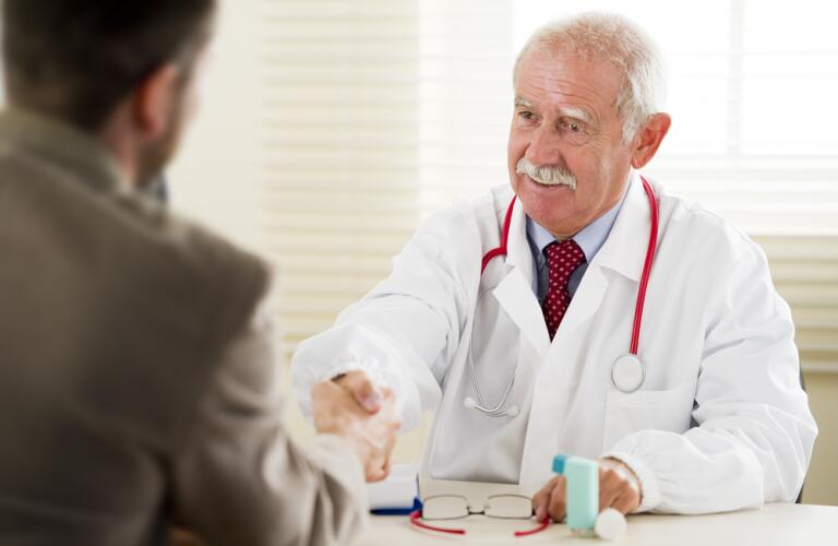 Male doctor with male patient