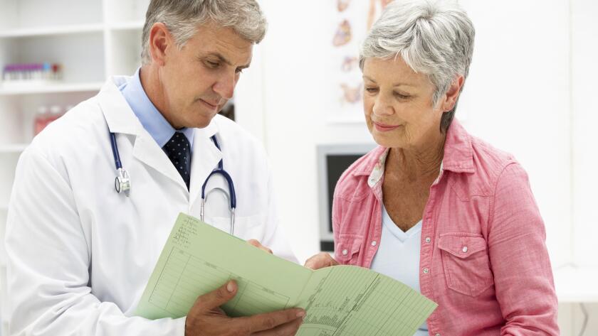 Doctor with senior female patient