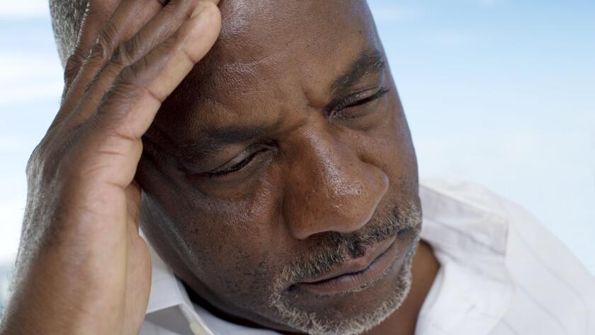tired-man-with-hand-on-head
