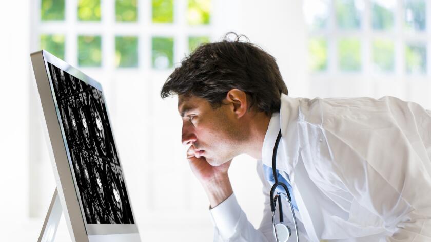 doctor-looking-at-liver-scan