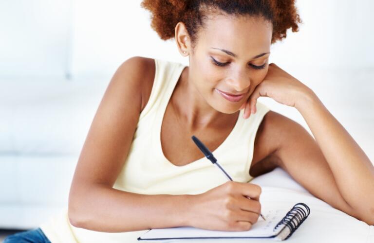 Woman making to do list