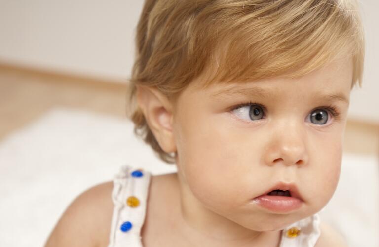Young child with lazy eye or crossed eye