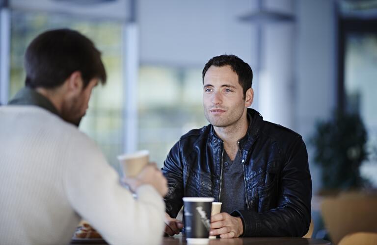 man-having-coffee-with-friend