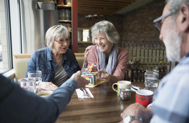 Group of Caucasian senior friends celebrating a birthday