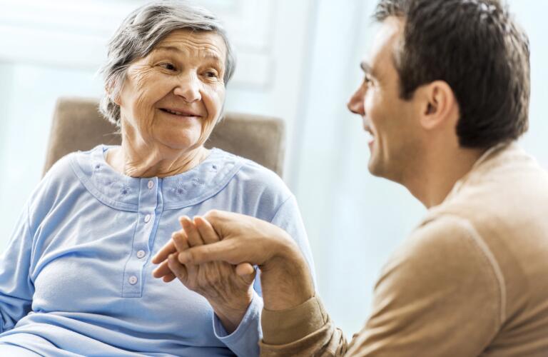 man talking with senior woman