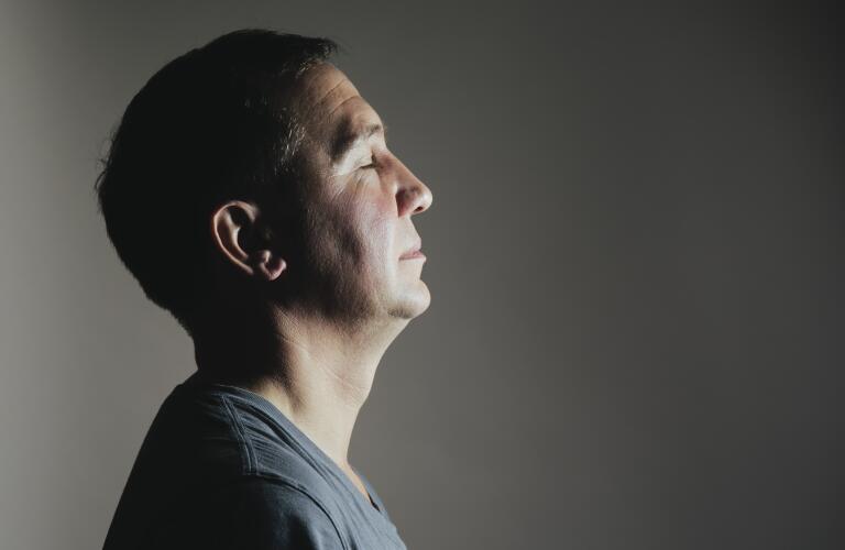 portrait of man with eyes closed