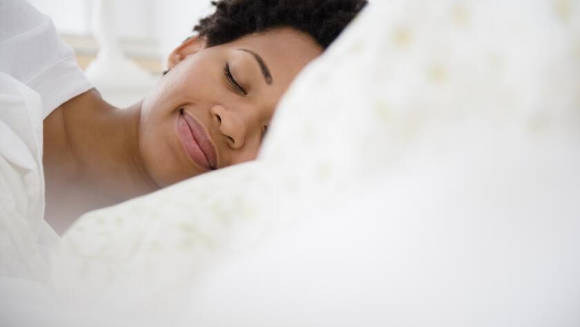 peaceful-woman-sleeping-in-bed