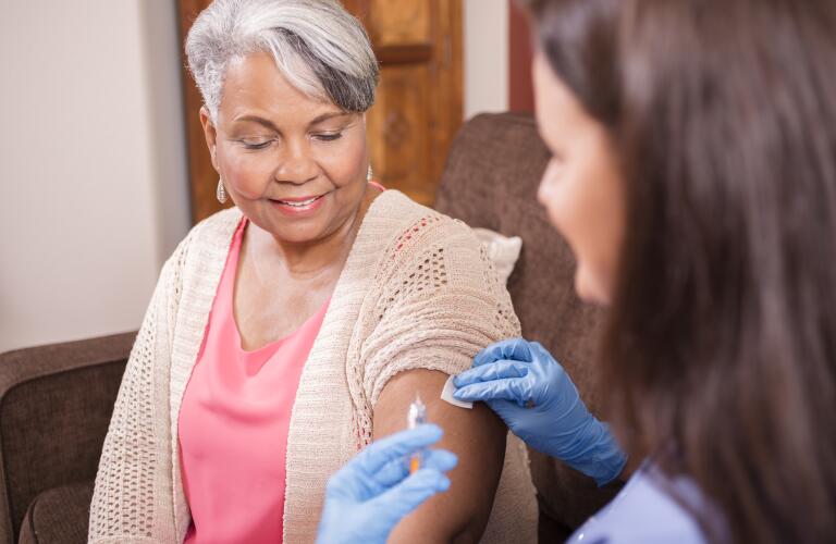 senior woman receiving injection