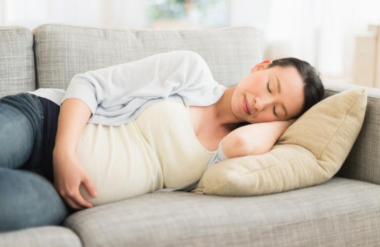 pregnant-woman-taking-nap-on-couch