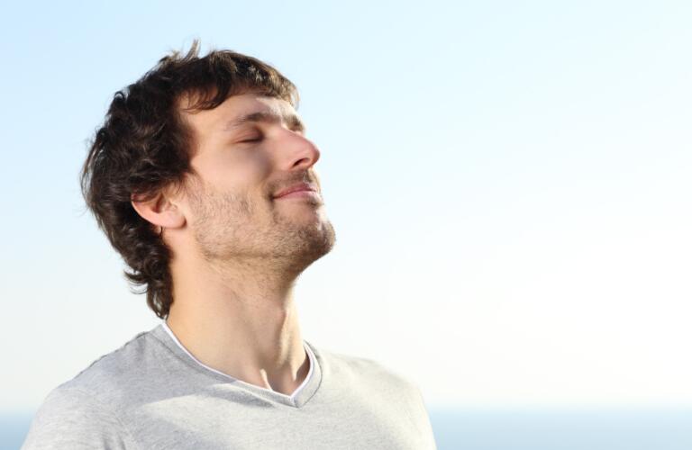 Close up of a man doing breath exercises outdoor