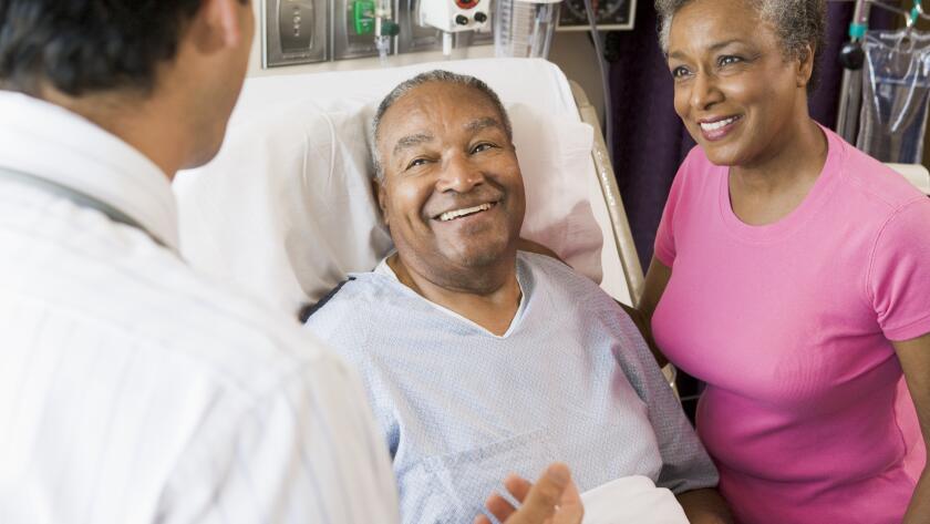 Senior Couple Talking with doctor
