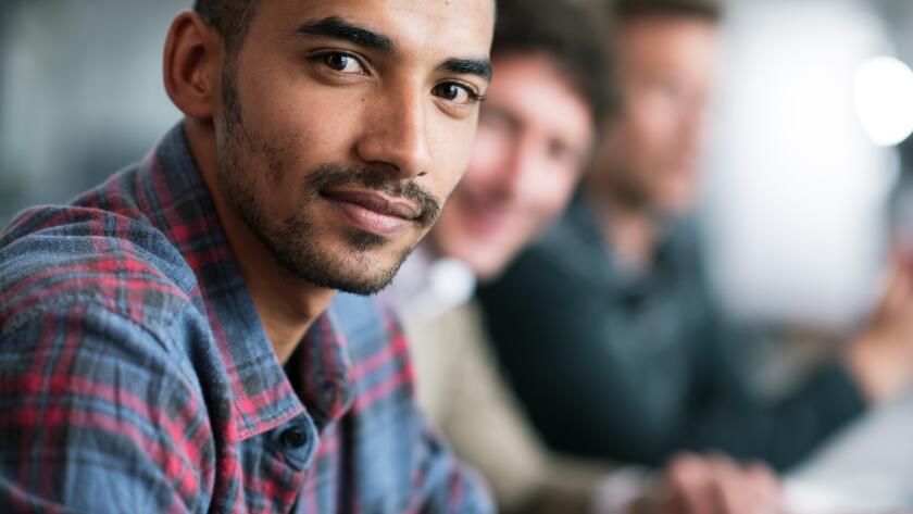 portrait-of-confident-man-looking-at-camera