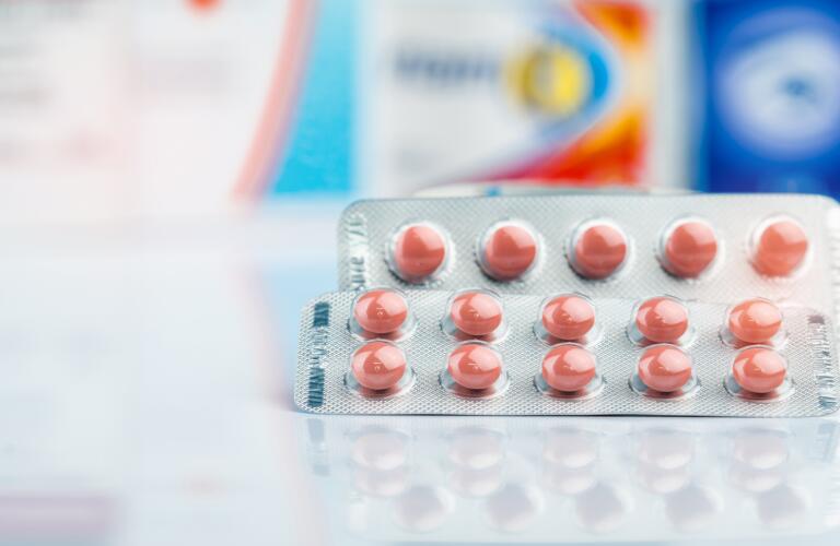 round tablets in blister pack on doctor table or pharmacy counter
