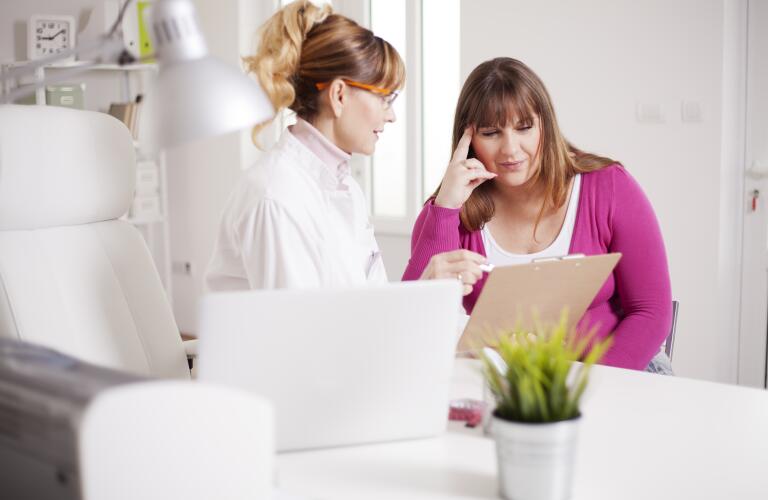 Woman discussing treatment options with doctor