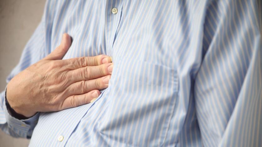 man-with-heartburn-pressing-chest