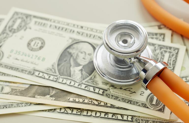 stethoscope on monetary bills