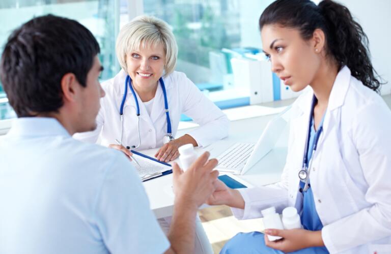 Doctor and Nurse with Patient