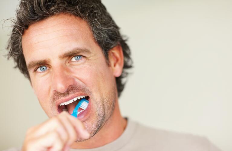 Man brushing teeth