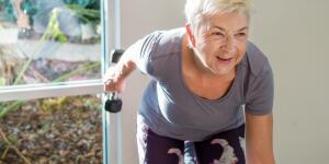 Senior Woman Exercising At Gym