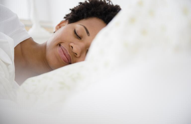 peaceful-woman-sleeping-in-bed