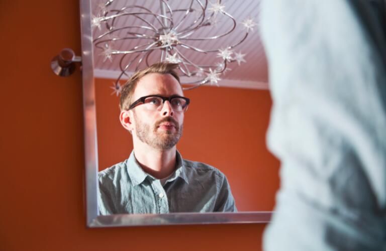 Man looking in mirror