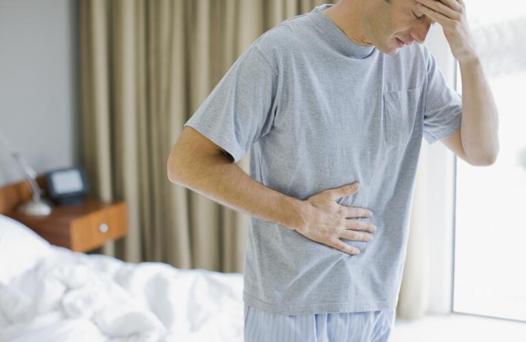man-with-stomachache-and-headache