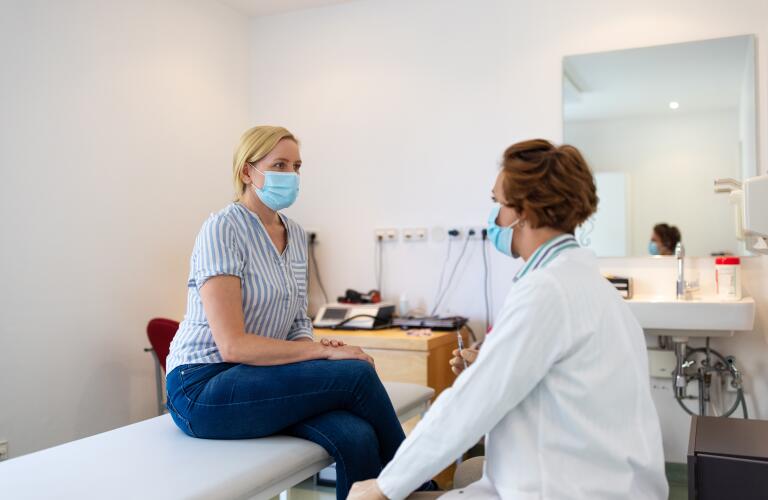 Woman visiting doctor during pandemic